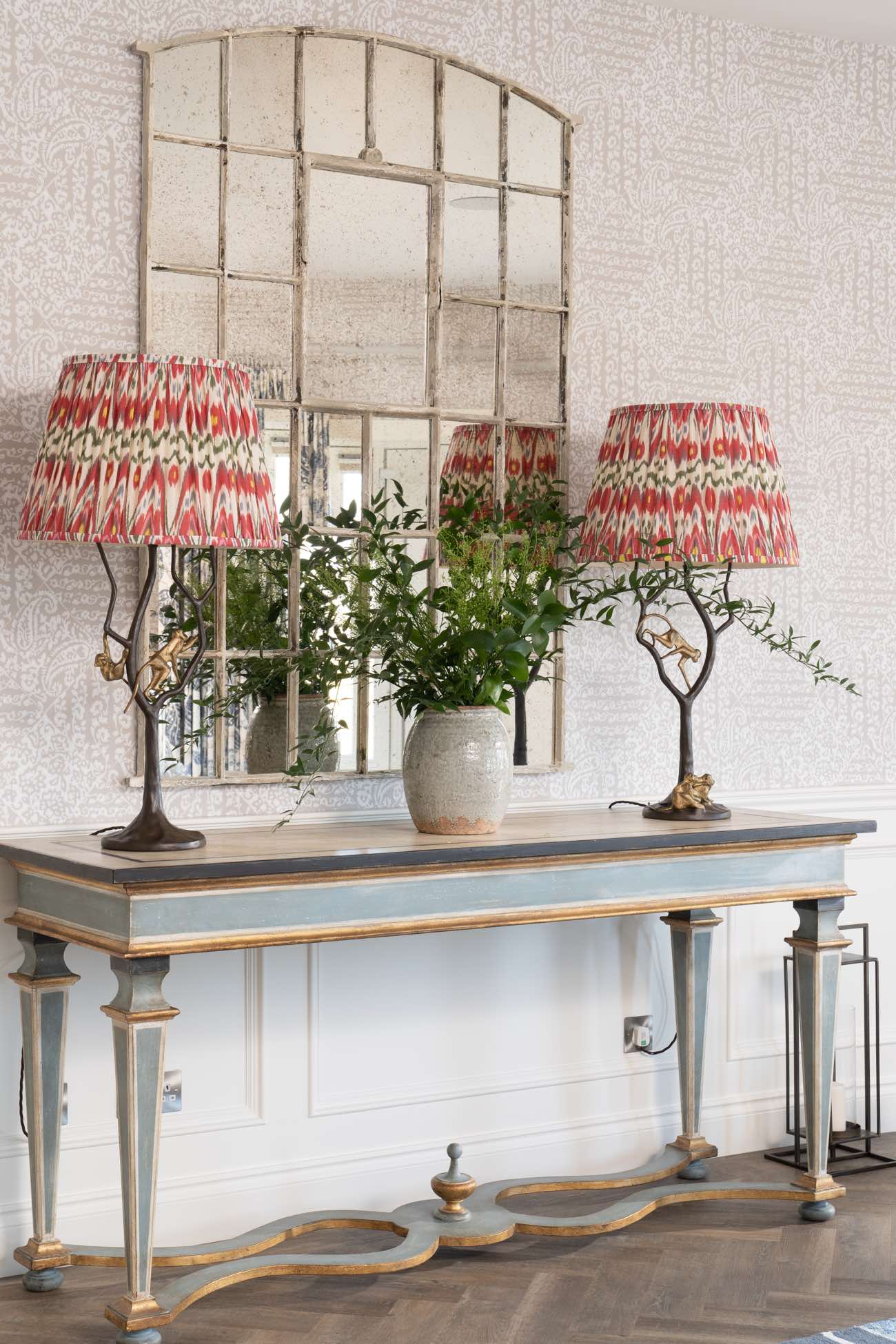 Matching lamps on dresser in hallway